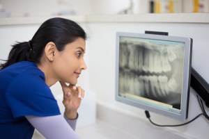 Woman looking at a dental X-ray