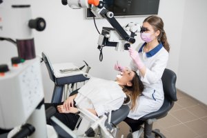 Doctor using a high power microscope